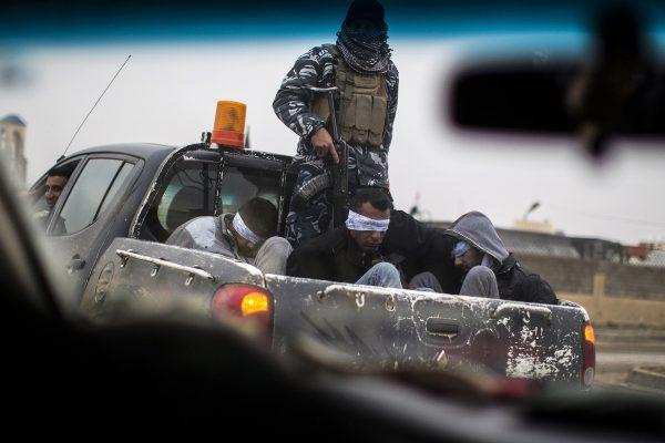 Jm Lopez / AFP / Getty Christian militia fighters from the Nineveh Plain Protection Units drive a pick-up truck in