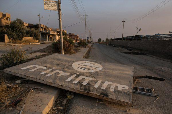 Chris McGrath / Getty An ISIS billboard is seen destroyed in the