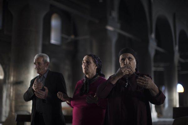 Felipe Dana / AP Iraqi Christians pray at the Church of the Immaculate Conception,