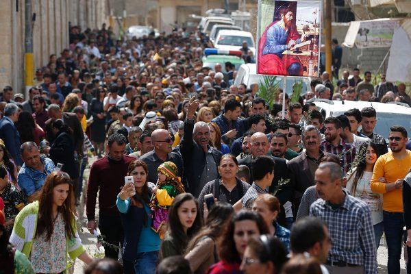 Ahmad Gharabli / AFP / Getty Iraqi Christian residents from Qaraqosh take part in a parade on April 9, 2017, as Christians celebrate