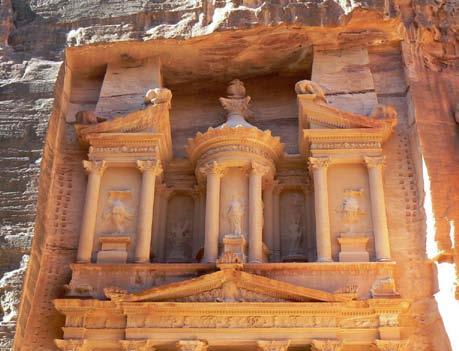 Firaoun, or Treasury of the Pharaohs, at Petra. The rich façade of the Treasury is cut from the rock face and rises to a height of about 130 feet.