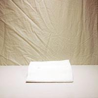 Altar Linens: Corporal A square piece of white cloth (shown here folded) spread over the