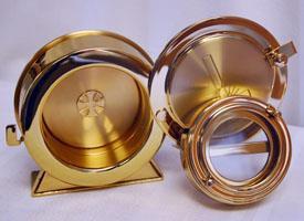 It slides into the center of the Monstrance pictured above. When the ceremony is completed, the lunette with the host is placed in this special Pyx which is kept in the tabernacle.