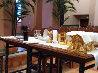 Place hand sanitizer and purificators (based on number of cups) next to Chalices on credence table (see
