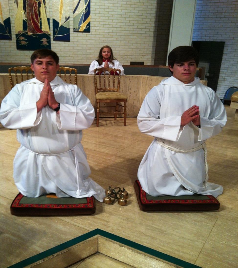 THREE ALTAR SERVERS RELATIVE POSITIONS DURING THE CONSECRATION ONCE THE HAND WASHING IS COMPLETE, THE ALTAR SERVERS ASSUME A STANDING POSITION BY THE CUSHIONS AND AT THE