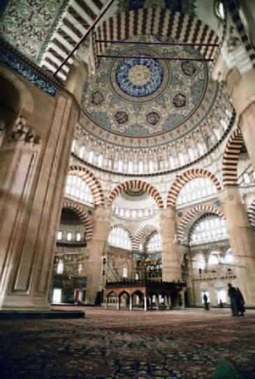 Extremely thin soaring minarets Abundant window space makes for a brilliantly lit interior Decorative display of mosaic and tile work Inspired by Hagia Sophia, but a centrally planned building