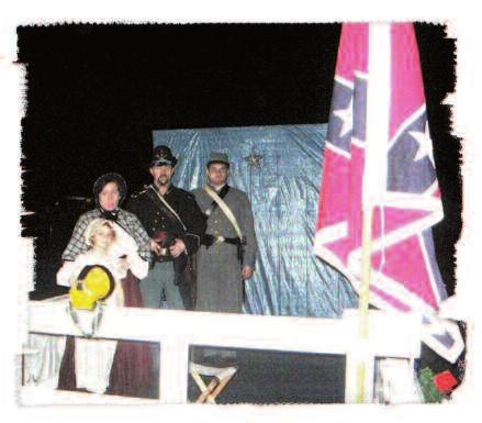 (Right) The float flew the American Flag, the Bonnie Blue, the Alabama State Flag, the First National, and the Confederate Battle