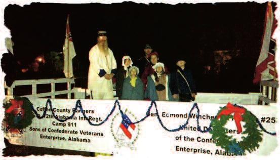 Deke and Amanda Scott and children, and Brandon Grant rode the float. The theme of the parade was Blue Christmas.