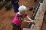They are taught good morals and good citizenship. Anne Blodgett washing her hands at the newly installed water spigots.