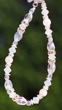 The matching bracelet (#2010) and earrings in dangle (#2011) or chandelier (#2011C) also contain the seven gemstones.