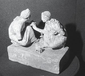 ILLUSTRATOR PHOTO/ DAVID ROGERS/ MUSEUM OF FINE ARTS/ BOSTON (316/1) Figurine of two girls playing knuckle bones. The bones, each of whose six faces were different, could be used as dice.