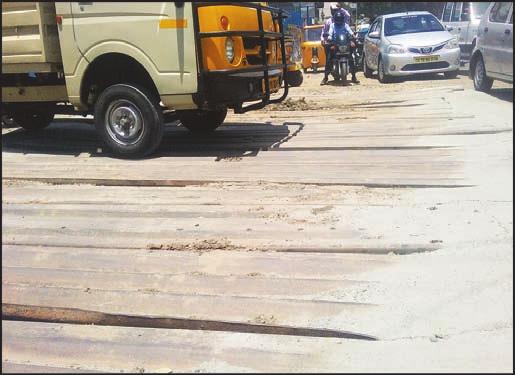 Metal plates used to cover trench on Vijayaraghava Road Metrowater workers have dug a wide trench cutting across the road at the junction of Vijayaraghava Road and North Boag Road junction, T.