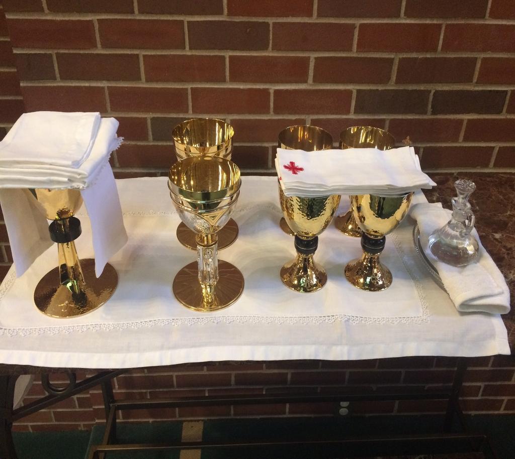 Credence Table Set Up Pre Mass * Chalice with on the Left side *Ciboriums next to chalice and paten on the right side