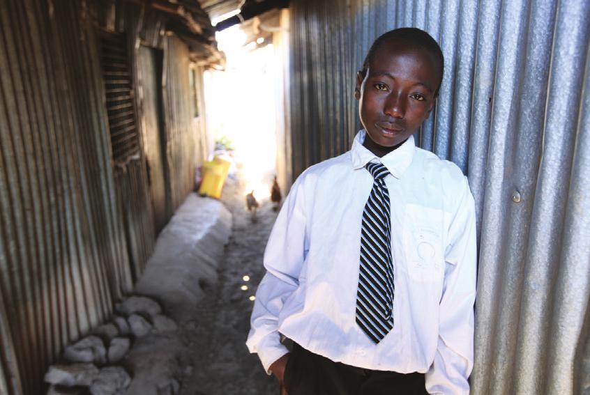 Levis pauses in an alley of Embulbul, a slum that he and other students of Brother Beusang Catholic Education Center call home.