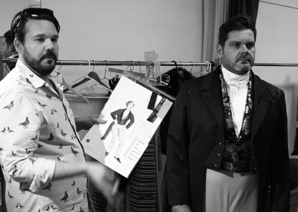 Top: Former Costume Designer Kristopher Castle holds his sketch of Scrooge s nephew Fred s suit, while actor Andy Gaukel models the fully realized creation. Bottom: Mrs.