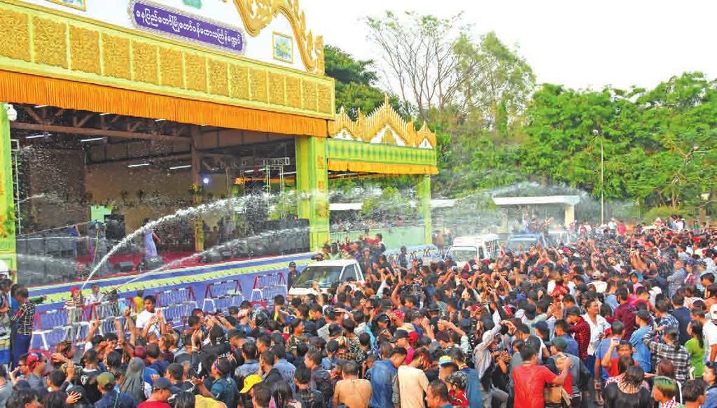 Thingyan by pouring water on each other yesterday. While water pandals in Nay Pyi Taw council area were crowded with revellers, me