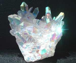 Angel Aura Quartz It both opens and activates the crown chakra, and assists one to channel desire toward the "proper" goals, assisting one to adjust and to be comfortable in all situations.