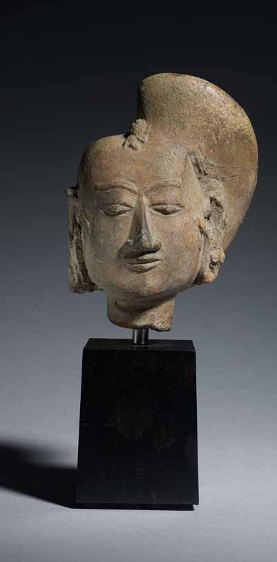14. Terracotta head of a woman Trowulun, East Java, Majapahit period, 14th century Height: 14 cm (5½in)