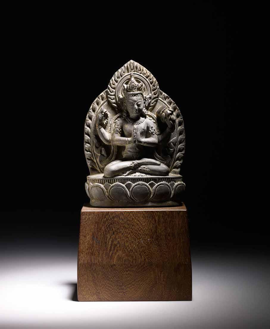 24. Stone four-armed Lokeshvara Nepal, 17th 18th century Height: 17 cm (6¾ in) Width: 12 cm (4¾ in) Provenance: private collection, Japan The bodhisattva