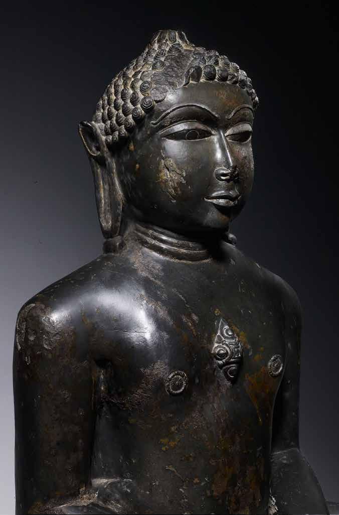2. Seated Jina Polished black stone Gujarat or Rajasthan, India, AD 1182 (Samvat 1239) Height: 64 cm (25¼ in) Width: 50 cm (19¾ in) Provenance: Christie s, London; private collection, London A Jina,