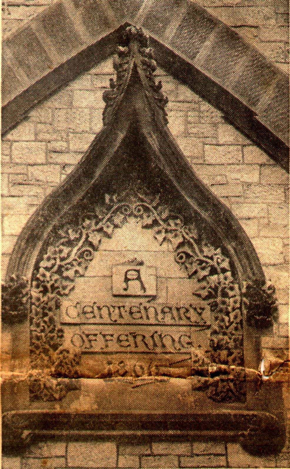 This plaque with vine motif the large façade window reads A Centenary Offering