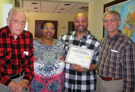 TULSA LITERACY CENTER GEORGE WASHINGTON (middle, right) and his tutor, OSCAR (far left), celebrated George s successful graduation from our Firm Foundations literacy program, completing Book 3.