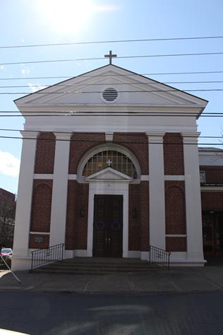 For the next twenty-two years mass would be held in Town Hall, at Park and East High until Church of the Paraclete was built.