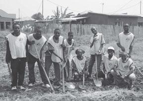 Members planted seedlings and seeds in the garden plot which had been prepared earlier by the young men.