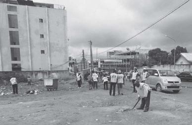 Photograph courtesy of Elder and Sister Evanson Members of a Cameroon Bastos Branch clean the area around city hall.