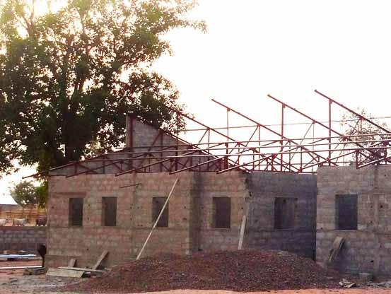 Raisi An update on Before June, the roof will go on the Benin Clinic building.