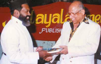 Malayali Directory handing over the copy of the Directory to Mr. K.V.