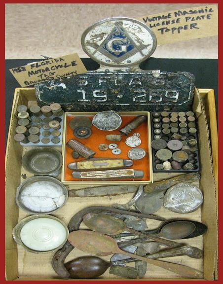 casings, bullets, buttons, silver plated spoons, mason jar lids, etc 2 nd Place Carolyn Harwick: Lead seals, harmonica reed, Valet safety razor part, spoons, railroad spike, bottles,