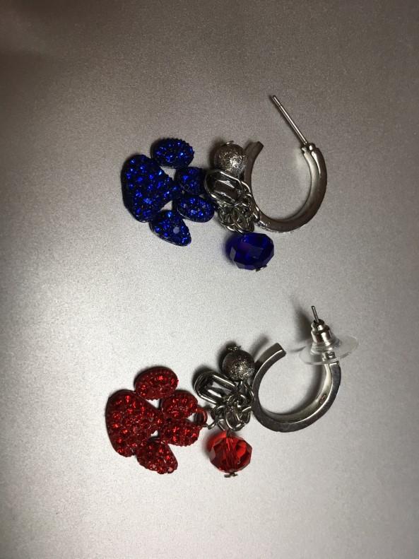 Thanksgiving) donated by Cheryl Burke and two pairs of red/blue UA earrings made and donated by Cindy Lowe.