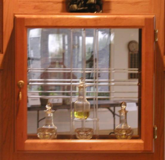 AMBRY; The cabinet that contains the Holy Oils used in three sacraments: Sacred Chrism for