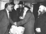 from right to left: R Zushe Wilmovsky, R Berke, R Shmuel Chefer, R Berke Wolf (on the side) R Berke with his son-in-law Eliyahu Friedman and his grandchildren R Berke receiving a dollar from the