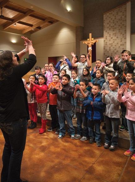 Katie Stroschein, shown here with the children she serves, is a passionate, faith filled young leader.