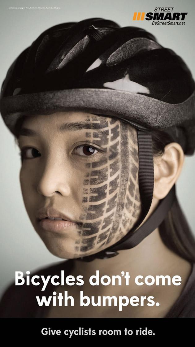 Ad #12: Girl in bicycle helmet with tire mark on face.