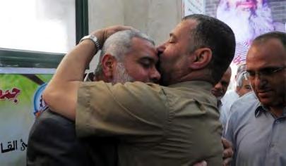 8 Ahmed Jaabari and Ismail Haniya (Filastin al'aan, October 21, 2011) After the prisoners were released, highranking Hamas figures repeatedly stressed the success of the deal and Israel's surrender
