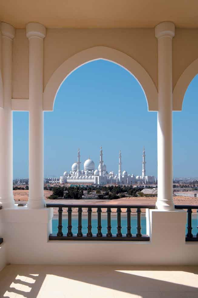 right on time, the melodic call for afternoon prayer soared from across the sparkling blue strait that separates Abu Dhabi island from the mainland.