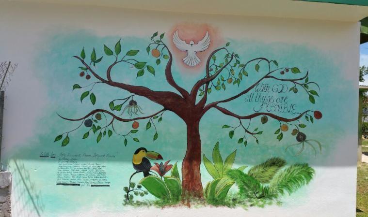 The mural says With God, All Things Are Possible.
