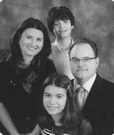 Bryan Collins was hired as the new Pulpit Minister in November of that year. (Pictured Middle Right Collins Family.