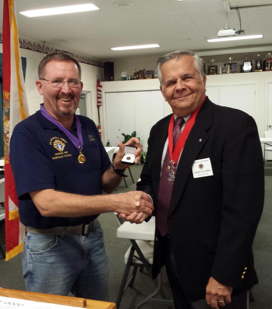 Deputy Grand Knight Steve Zajac receives the 2014 Star Council