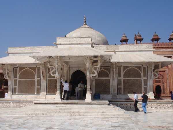 Now pilgrims, and supplicant childless women, came to the square white marble mausoleum within the grand open mosque in search of a miracle and to honor the Muslim mystic who inspired Akbar to build
