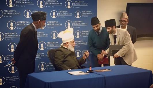 Huzoor asked Safwan Chaudhry (in-charge Canada Media Team) and I some questions