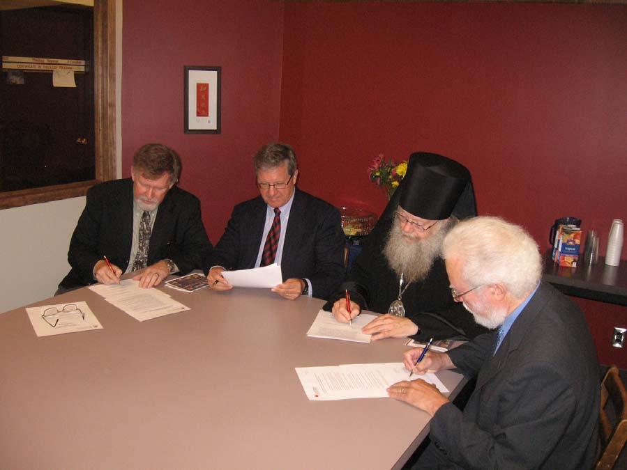 The signing ceremony of an association agreement between St Arseny Orthodox Christian Theological Institute and University of Winnipeg s Faculty of Theology.