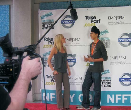 Being interviewed at a Film Festival. coming up with a simple, effective solution through his chosen medium film. Through his films and with them he continues to mature creatively and spiritually.