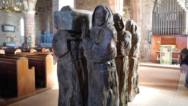 Sculpture of monks carrying the body of