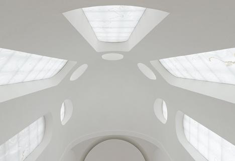 Slices of finely veined translucent white stone (onyx) were laminated to glass and installed in the windows in the apse.