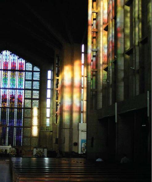 Large panes of stained glass bring in light in a diffused manner.