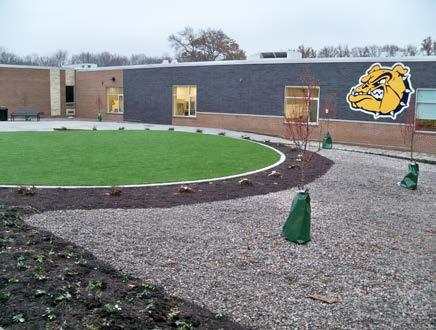 The open courtyard that was located south of the cafeteria is now enclosed by the addition of new wings (left).